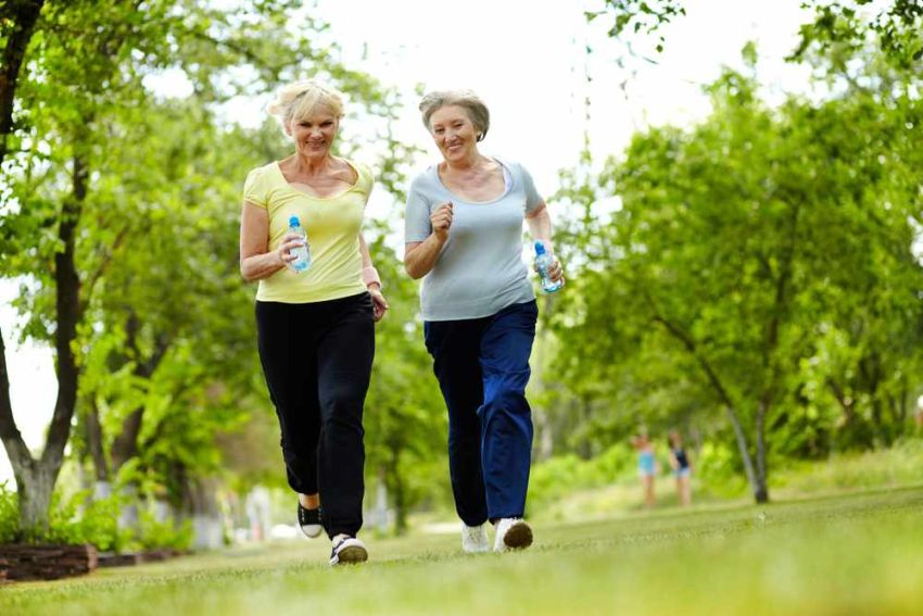 two happy women exercising
