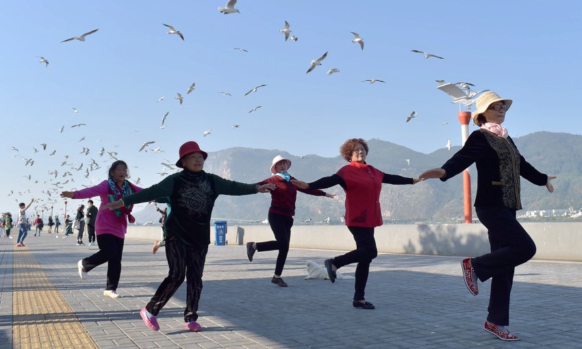 chinese pensioners exercise in open air