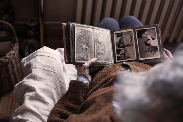 dementia patient watching photo album