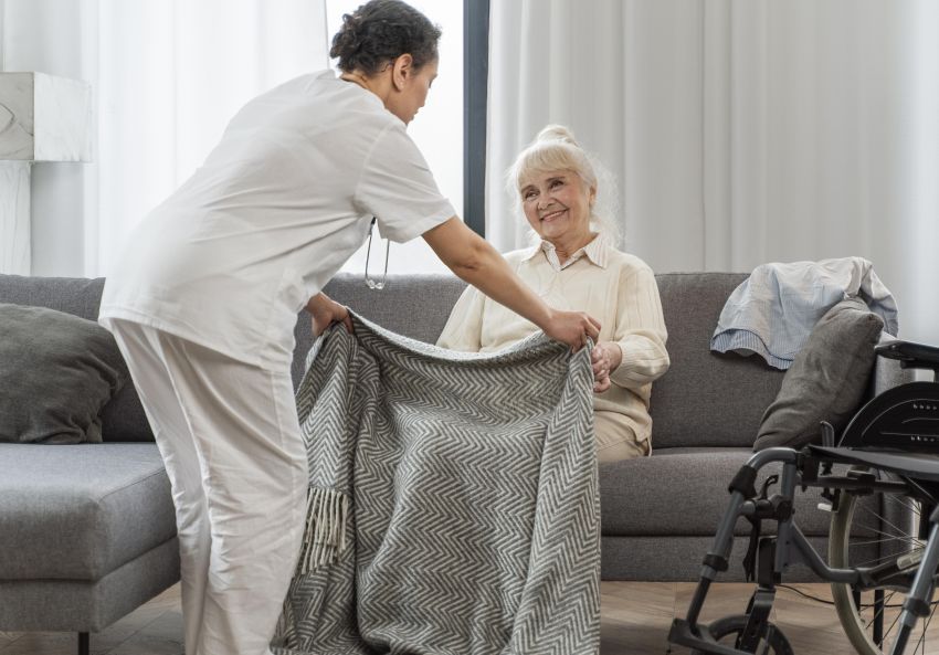 doctor taking care senior woman in care home