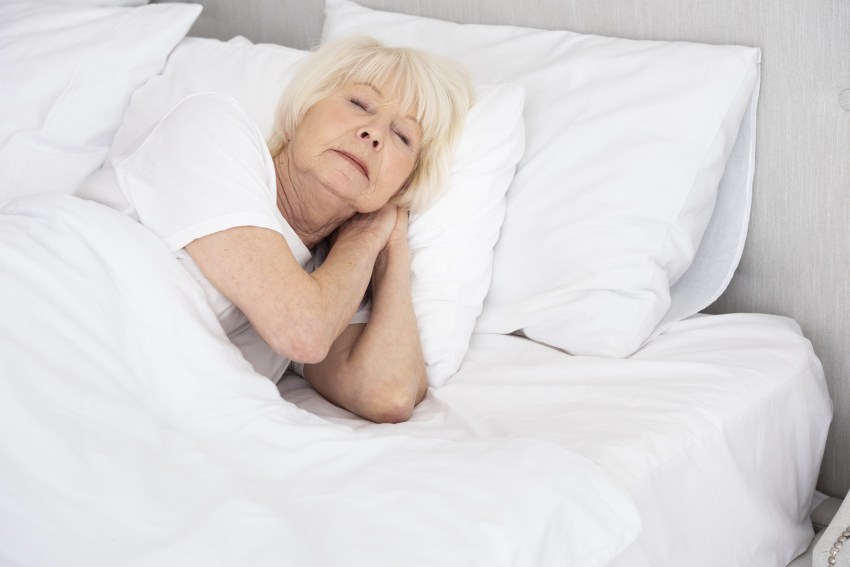 elder woman sleeping her bed