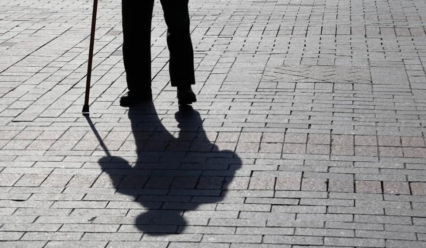 elderly man walking and shadow
