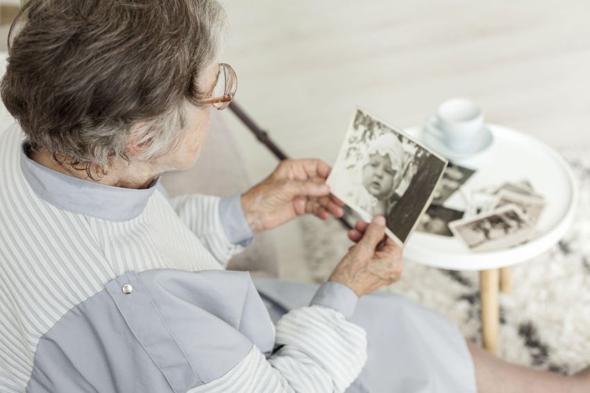 grandmother looking old pictures 