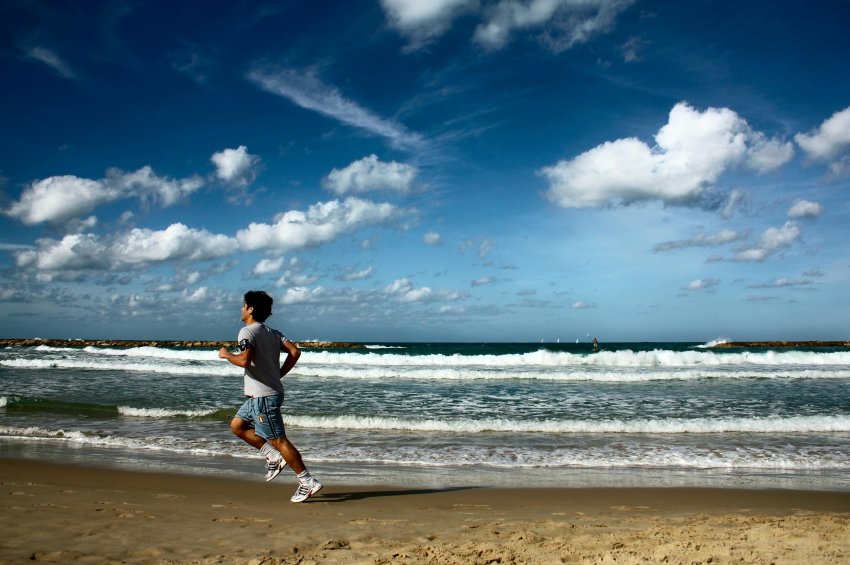 man running on beach 625x390