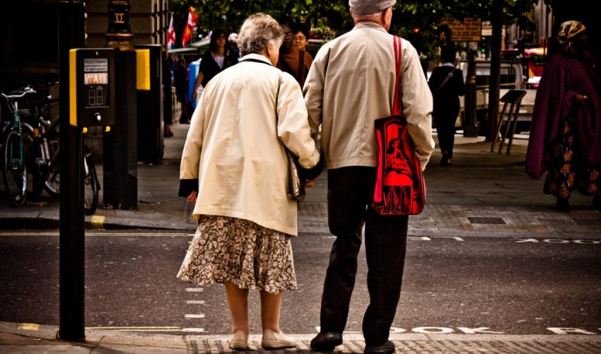 old couple crossing the street