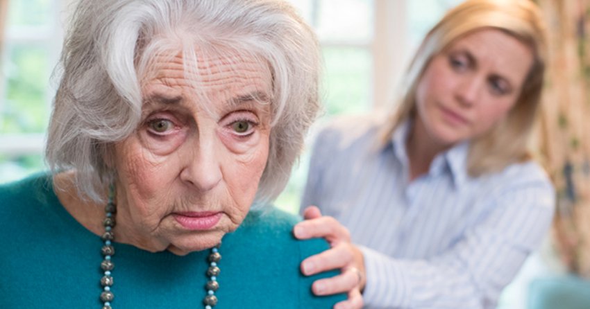 Confused Senior Woman With Adult Daughter At Home