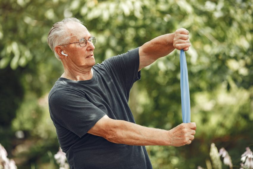 senior man summer exercise in park 