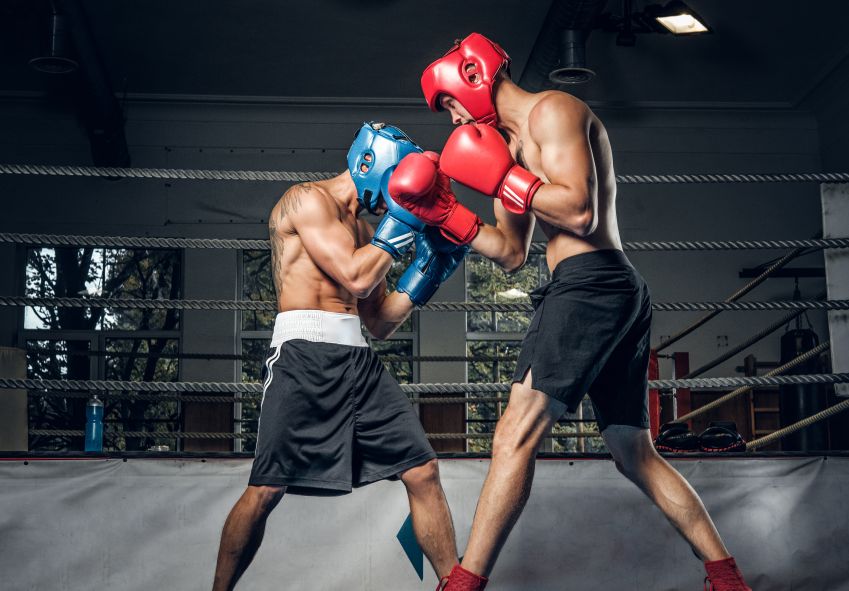 two boxers fighting on ring head impact